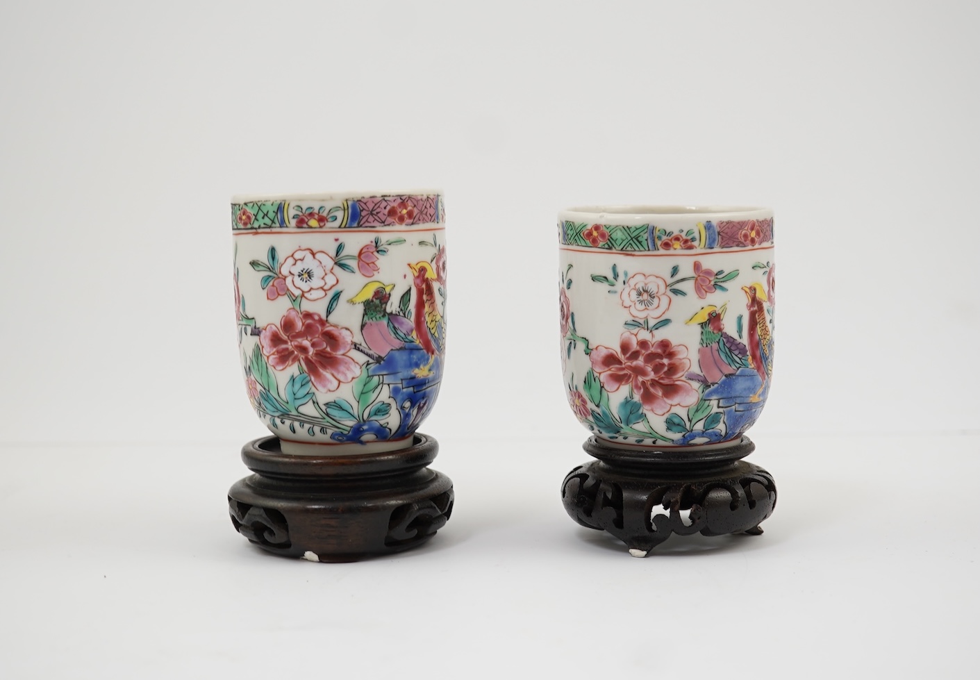 A near pair of Chinese famille rose ‘double pheasant’ coffee cups, early Qianlong period